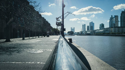 Street amidst buildings in city against sky