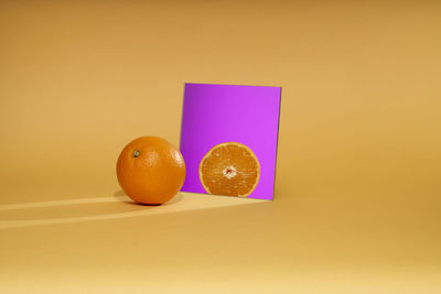 Directly above shot of oranges on yellow background