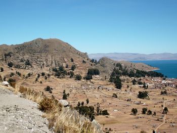 Scenic view of mountains against clear blue sky