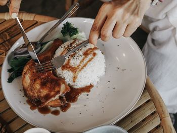 High angle view of person preparing food on table