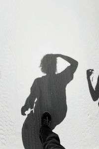Person standing on wall