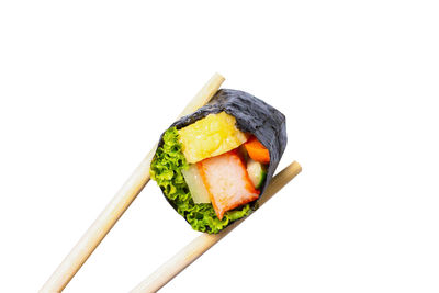 Close-up of sushi against white background
