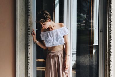 Woman looking through window