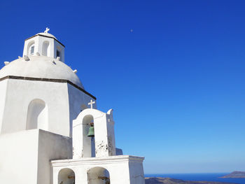 Low angle view of building against blue sky