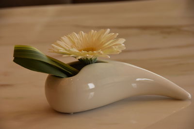 Close-up of white flower vase on table