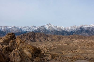 Scenic view of snowcapped mountains against clear sky