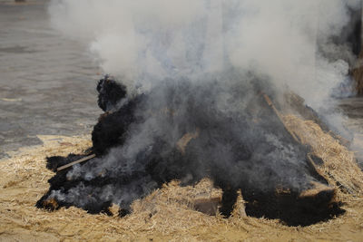 Smoke emitting from volcanic mountain