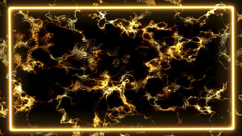 Full frame shot of illuminated fire against black background