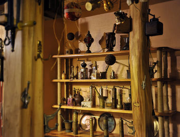 Centerpieces arranged on wooden shelves at store