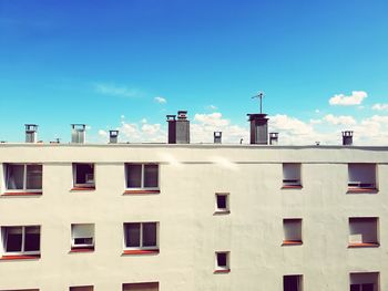 Low angle view of building against blue sky