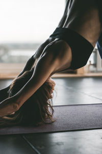 Low section of woman relaxing on floor