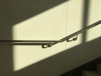 Low angle view of metal railing on wall