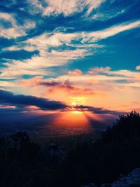 Scenic view of silhouette landscape against sky at sunset