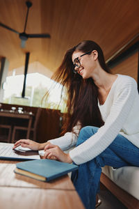 Young woman using mobile phone