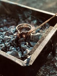 High angle view of utensil on coal