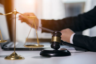 Close-up of hand holding table