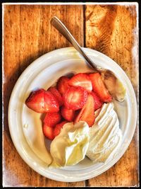 Directly above shot of strawberries in bowl on table