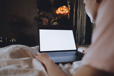 Midsection of woman using mobile phone