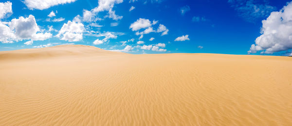 Panoramic view of desert against sky