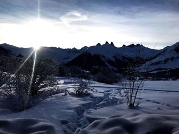 Scenic view of snowcapped mountains against sky