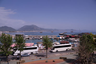 Scenic view of sea by city against sky