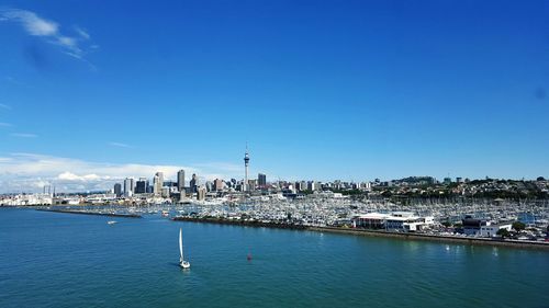View of cityscape against blue sky