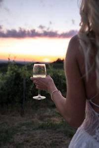 Midsection of woman drinking water from glass