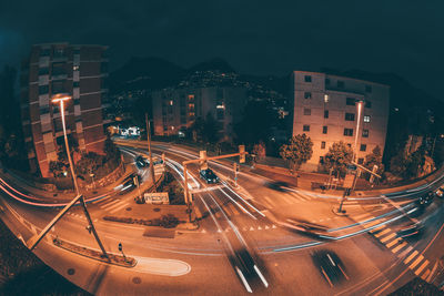 High angle view of light trails on road at night