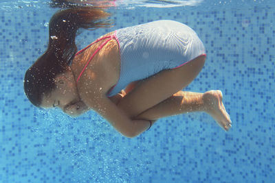 Close-up of woman swimming in pool