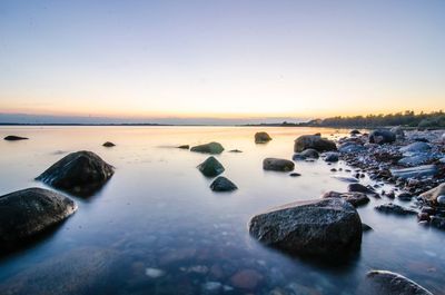 Scenic view of sea against sky during sunset