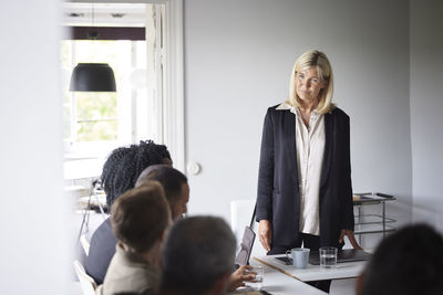 Smiling businesswoman at meeting