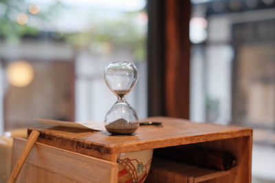Close-up of clock on table