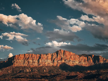 Rock formations on landscape against sky