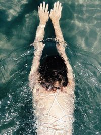 High angle view of woman swimming in pool