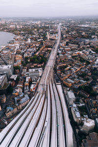 High angle view of railroad tracks amidst buildings in city