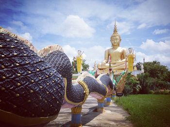 Statue of buddha against sky