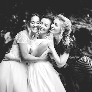 Portrait of smiling young woman standing outdoors