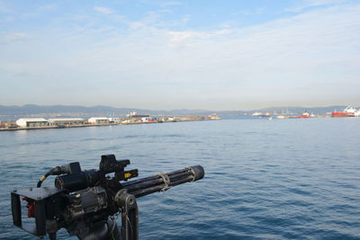 View of city by sea against sky