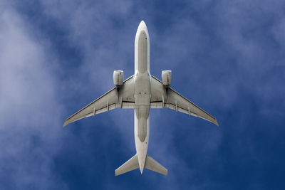 Low angle view of airplane against sky