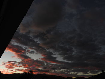 Low angle view of dramatic sky during sunset