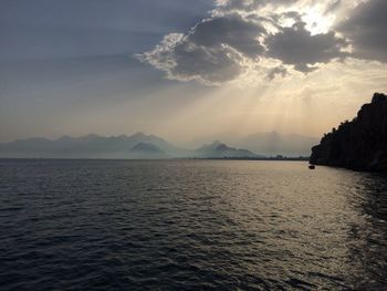 Scenic view of sea against cloudy sky