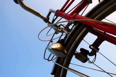 Low angle view of chain hanging against clear sky
