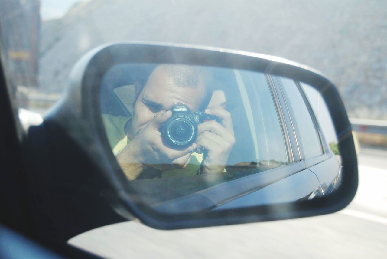 transportation, mode of transport, car, close-up, reflection, land vehicle, glass - material, vehicle interior, transparent, side-view mirror, focus on foreground, window, indoors, car interior, day, travel, mirror, part of, sunglasses, selective focus