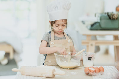 Portrait of a girl having food at home