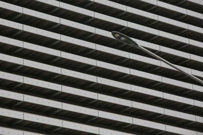 Low angle view of street light against building