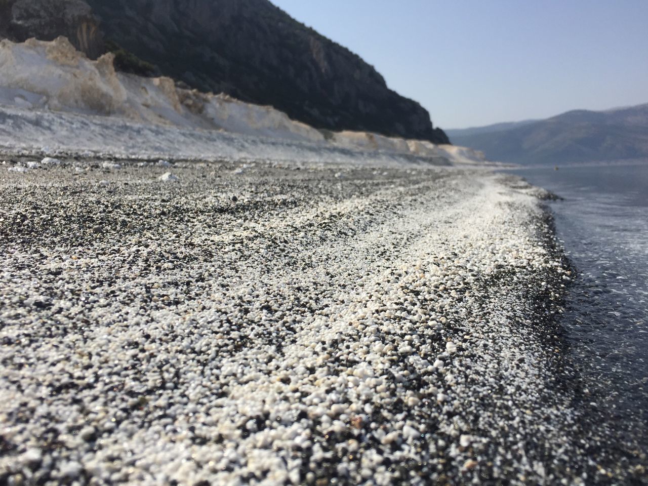 mountain, outdoors, nature, day, beauty in nature, tranquil scene, scenics, tranquility, beach, no people, water, clear sky, sea, sky, pebble beach