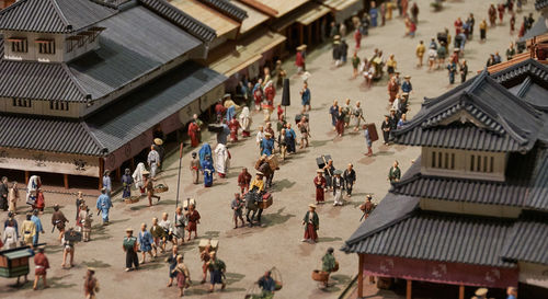 High angle view of model depicting people and buildings of historic japan