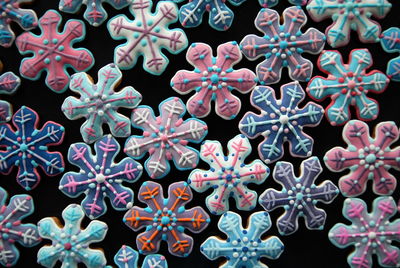 Full frame shot of colorful candies on black background