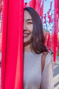 Portrait of smiling woman standing outdoors