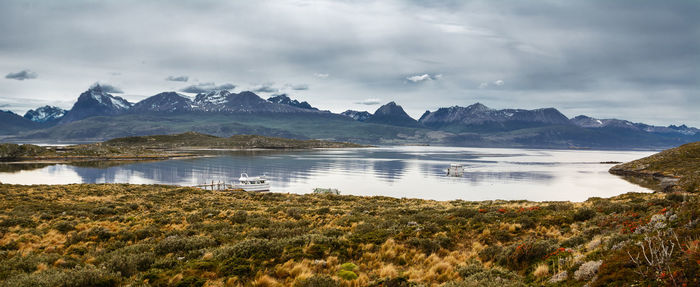 Scenic view of lake and mountains against sky